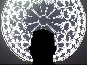 Mandala window with 教师 member's silhouette